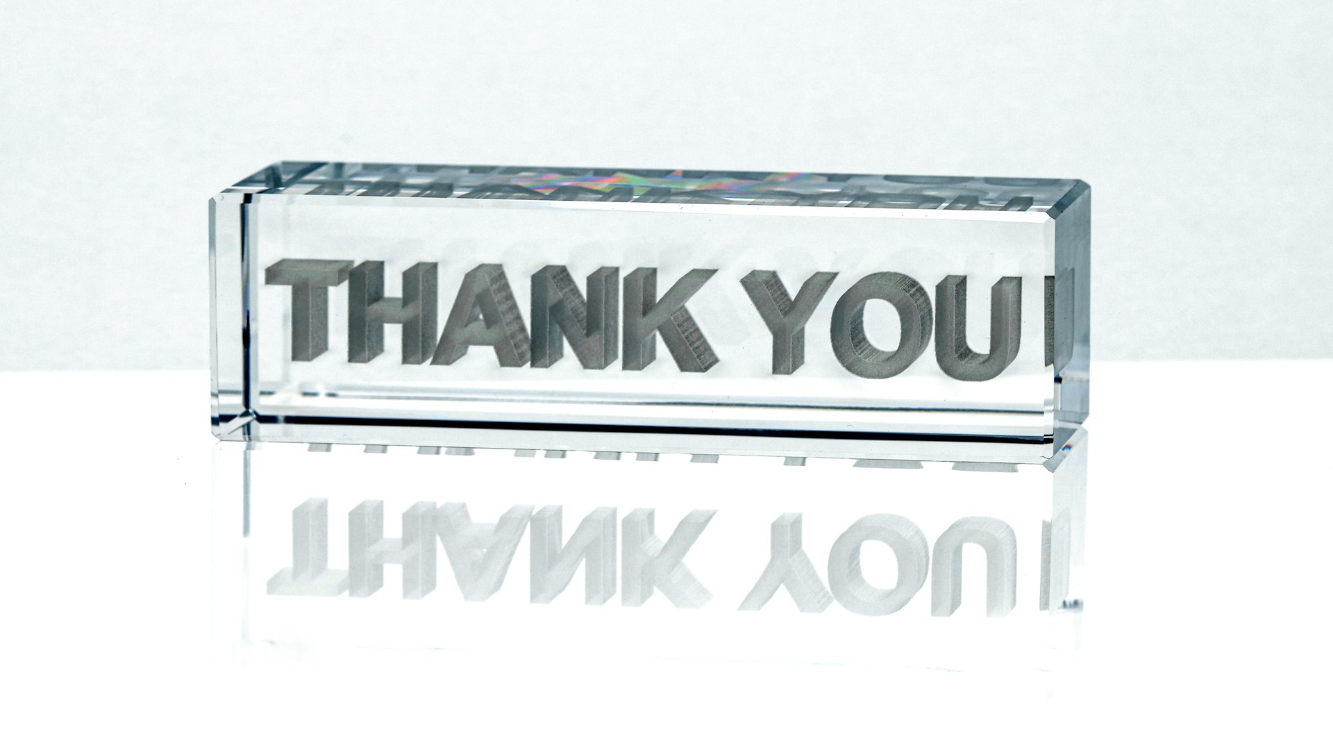 a glass block with the words thank you on it