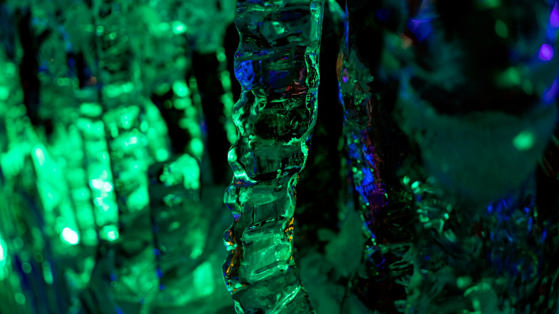 a close up of a green and blue ice sculpture