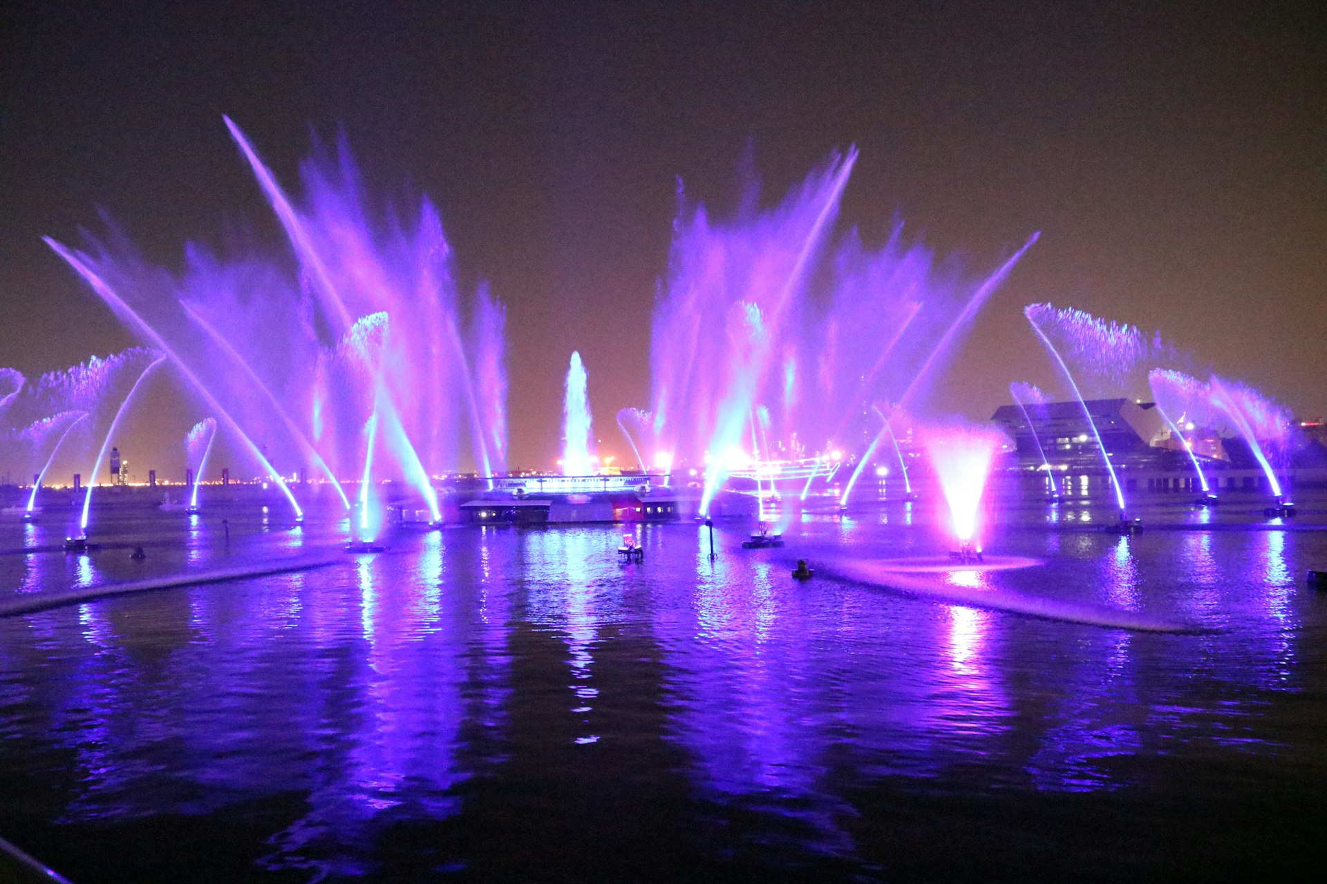 fireworks going off over water