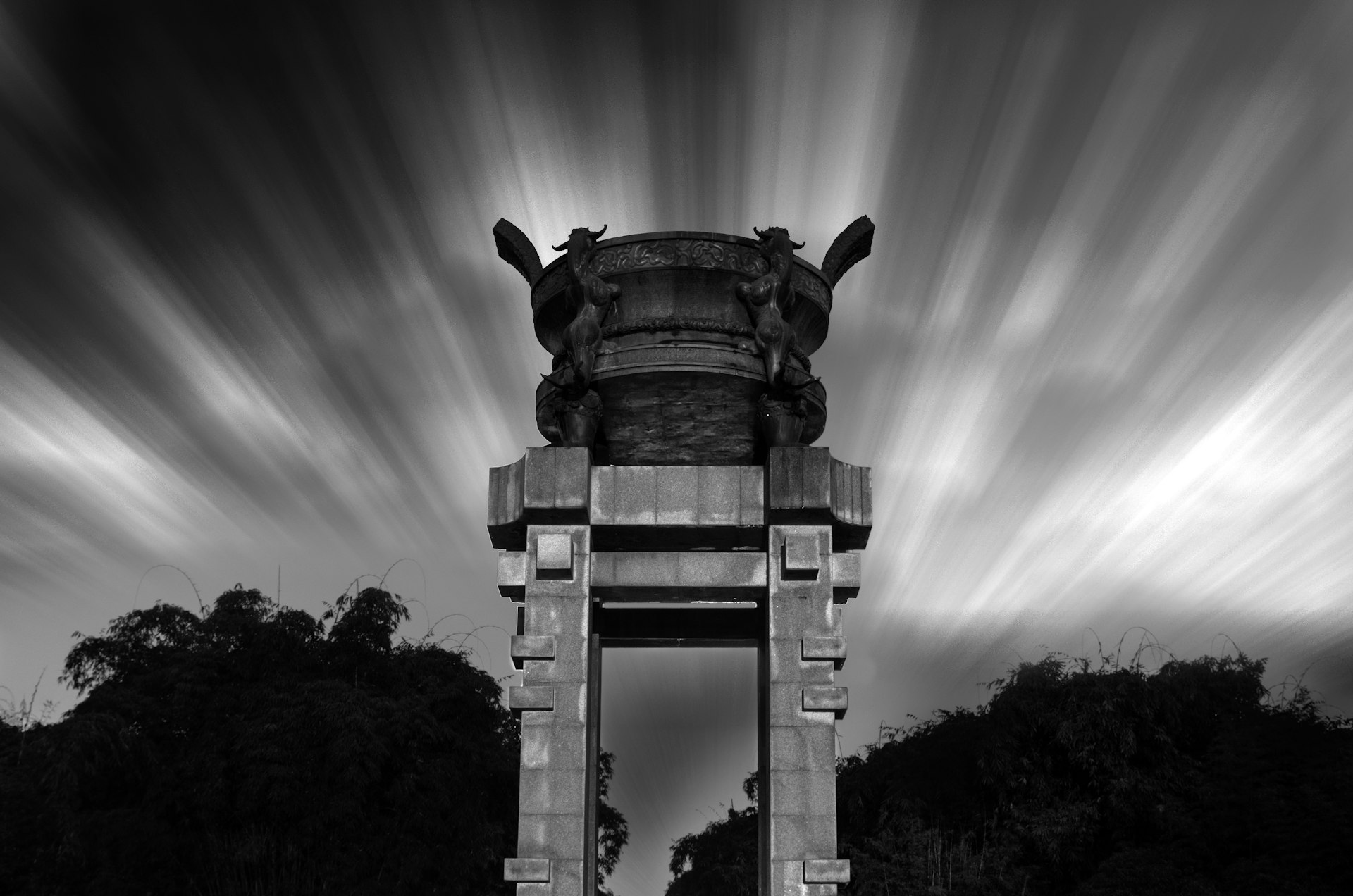 a black and white photo of a statue