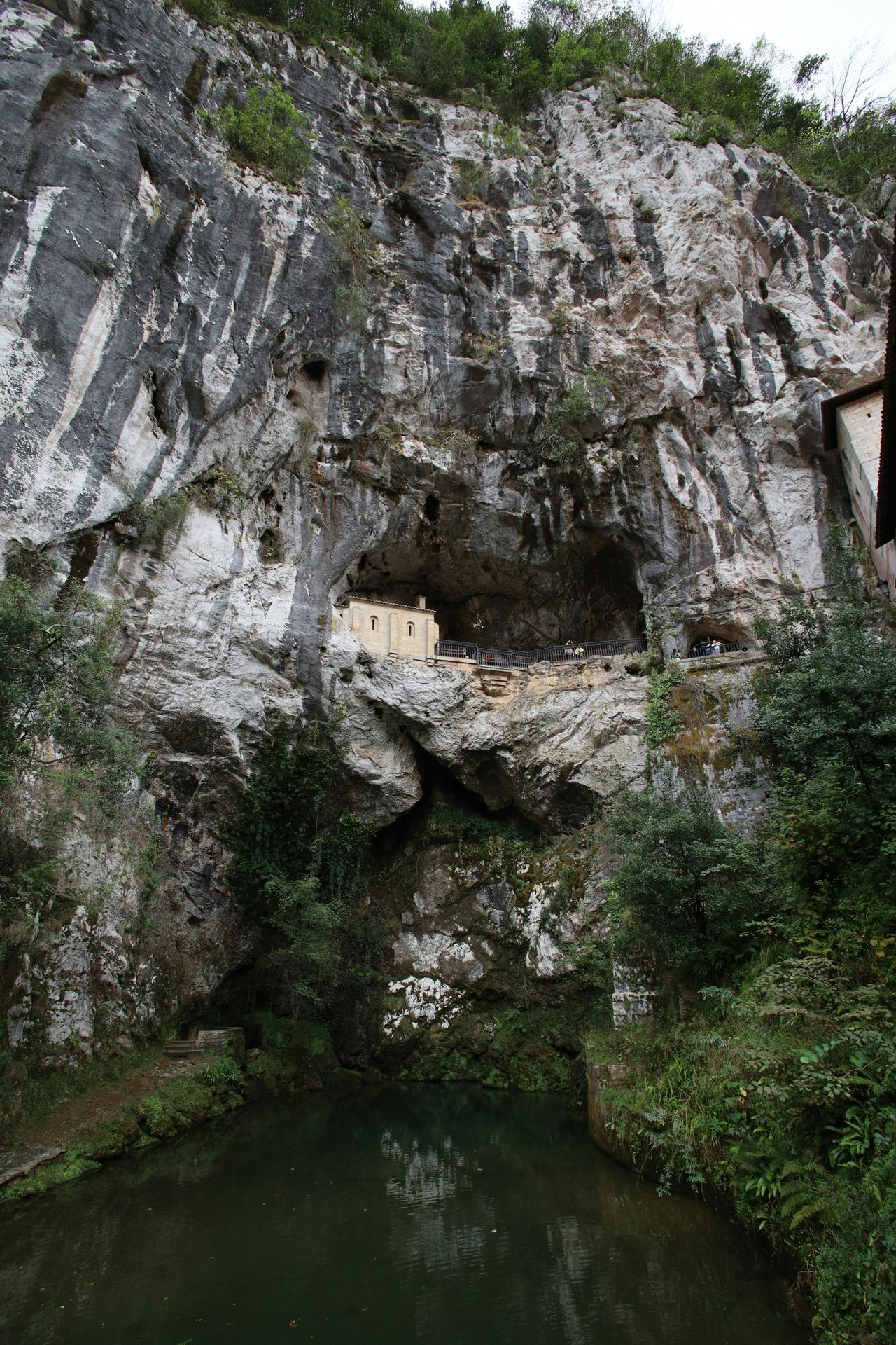 a cliff side with a building on it