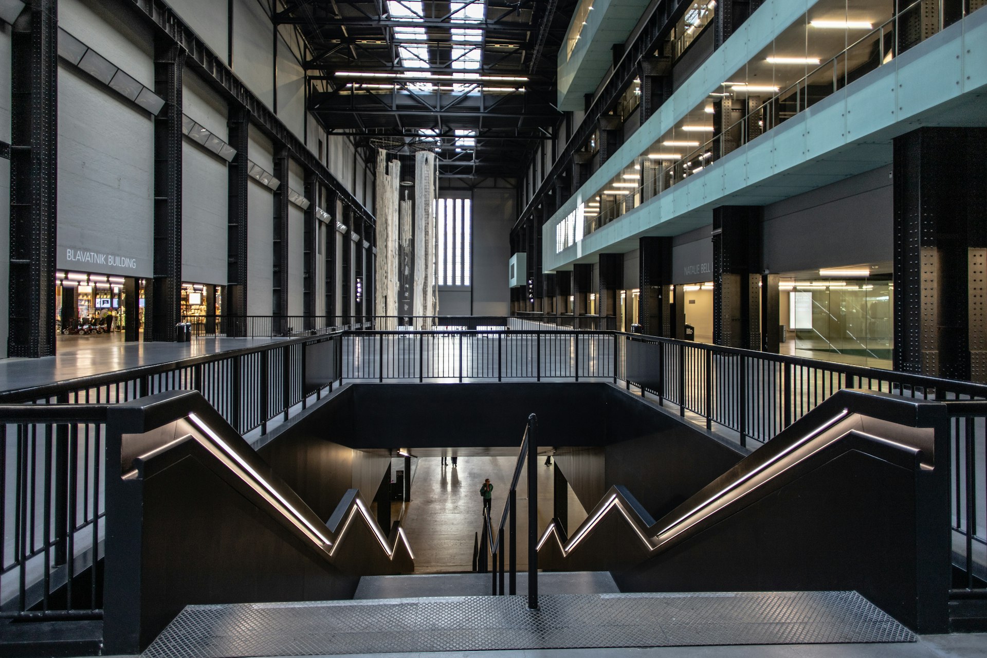 An empty building with stairs leading up to the second floor