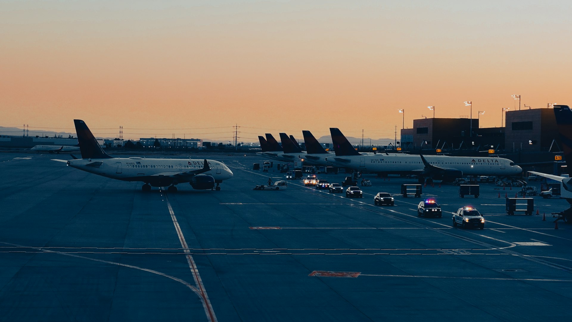 A group of airplanes parked on a runway