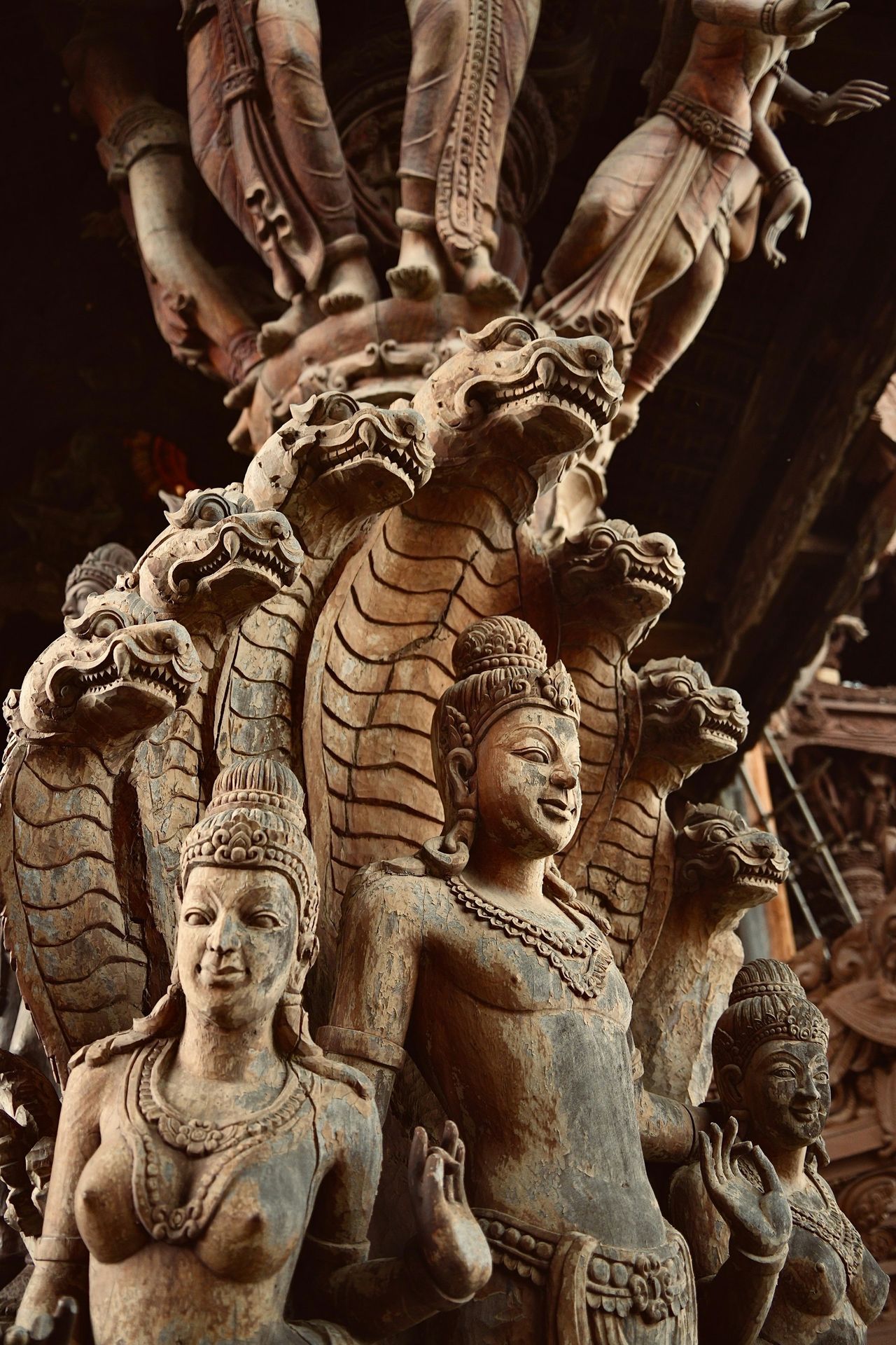 A statue of a woman and two men