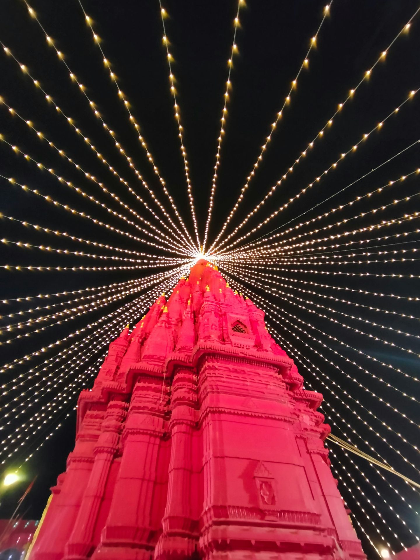a large red bridge with lights