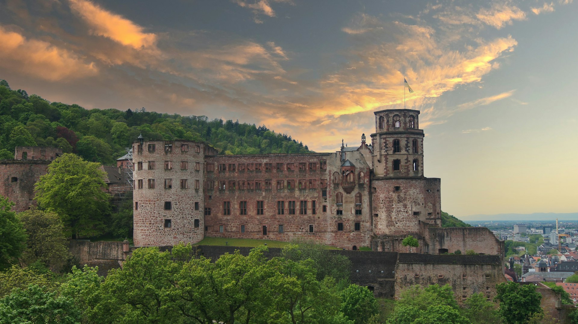 Heidelberg castle towers under a beautiful sunset.