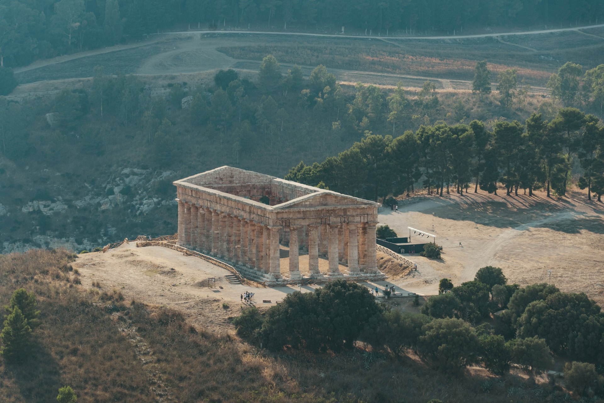 a large stone building with trees around it
