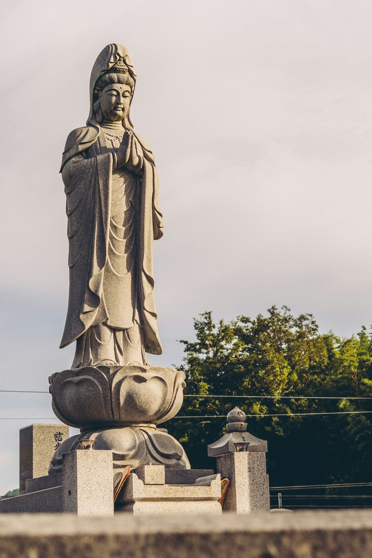 a statue of a person with a hat on