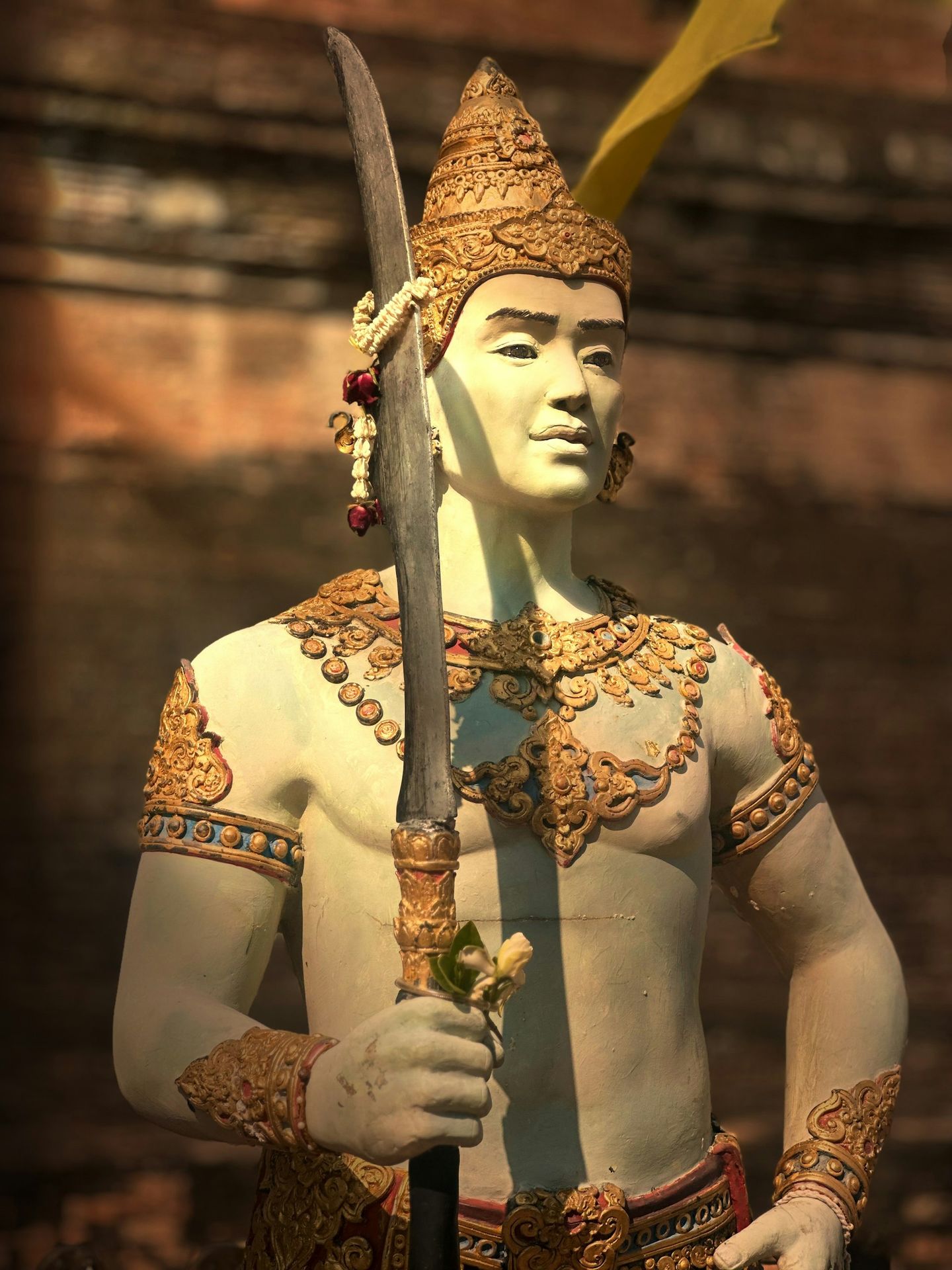 A statue of a man holding a sword
