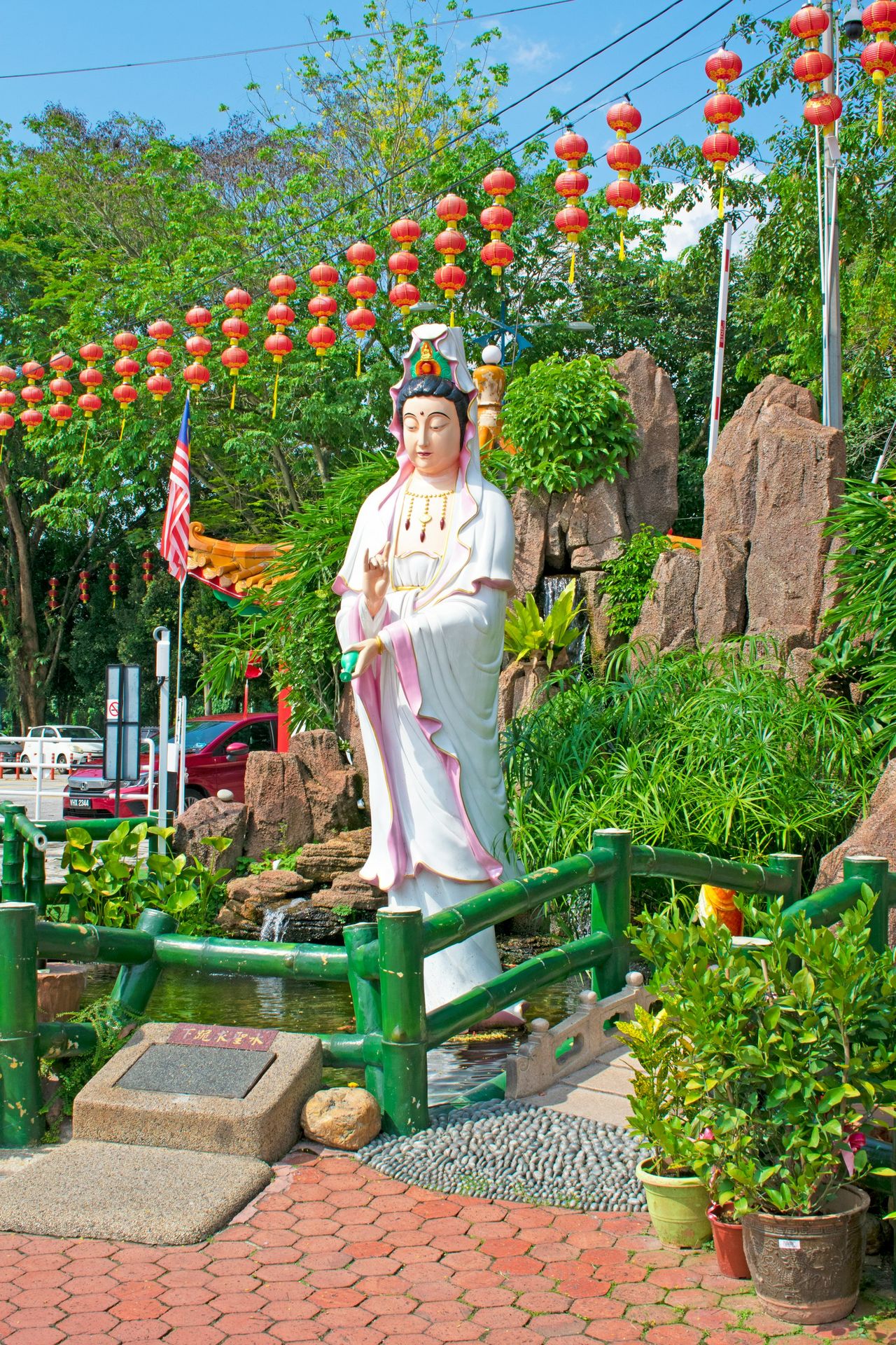 a statue of a person in a garden