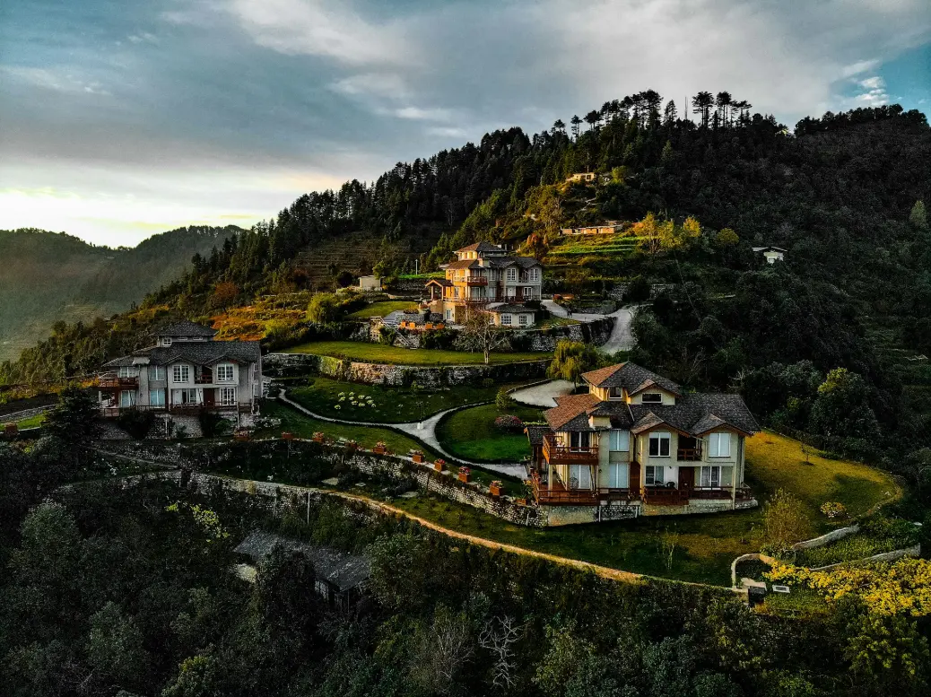 white and brown concrete house on hill