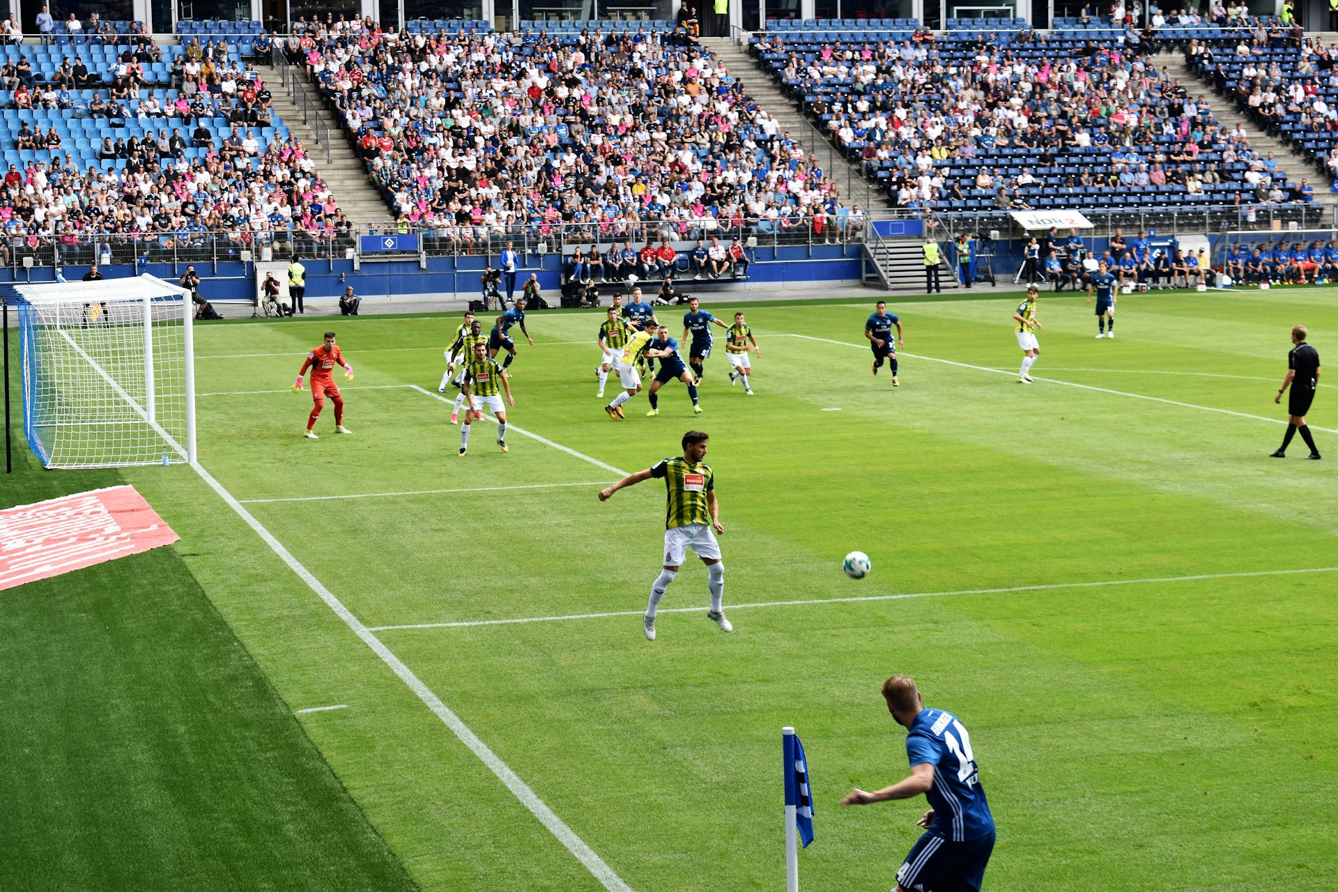 men playing soccer of soccer field during daytime