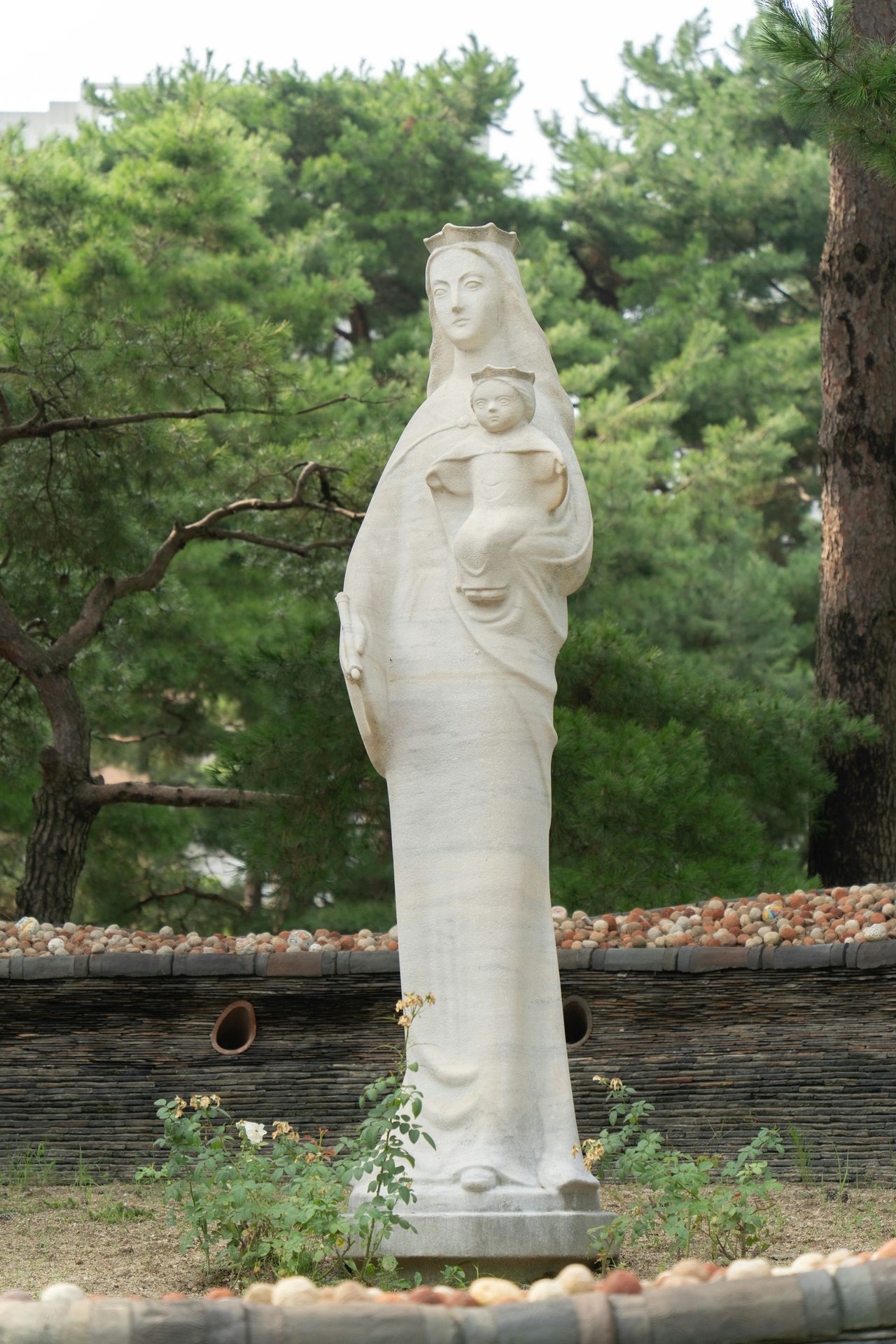 A statue of a woman holding a cup