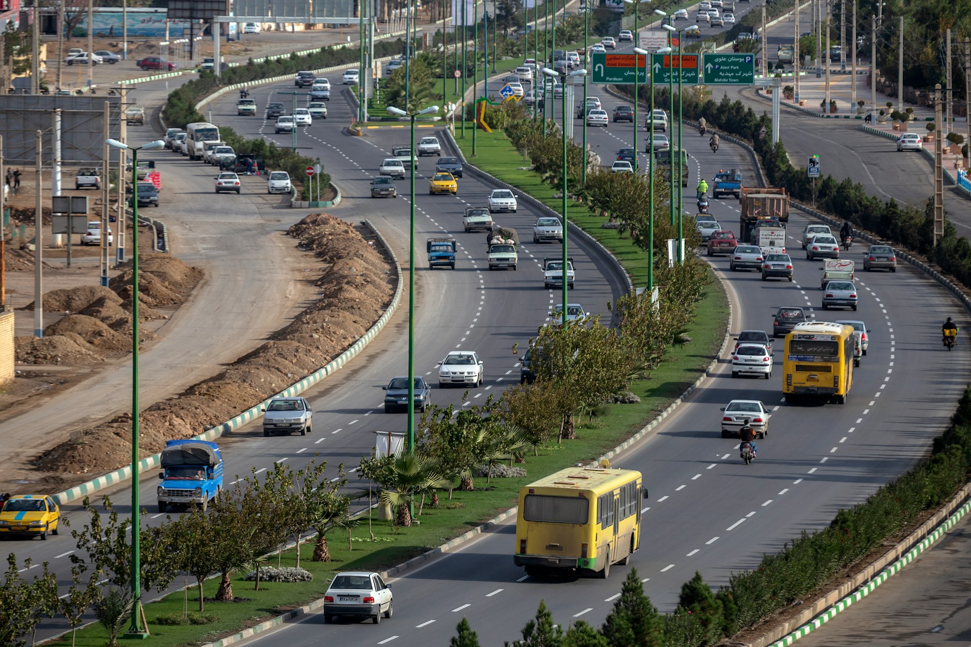 vehicles passing on road during daytime