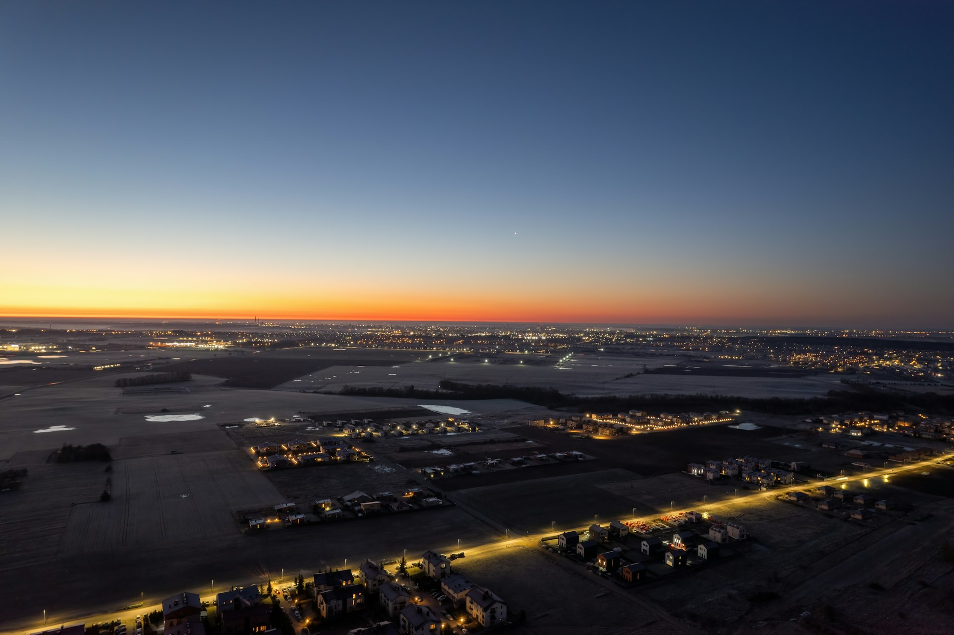 an aerial view of a city at night