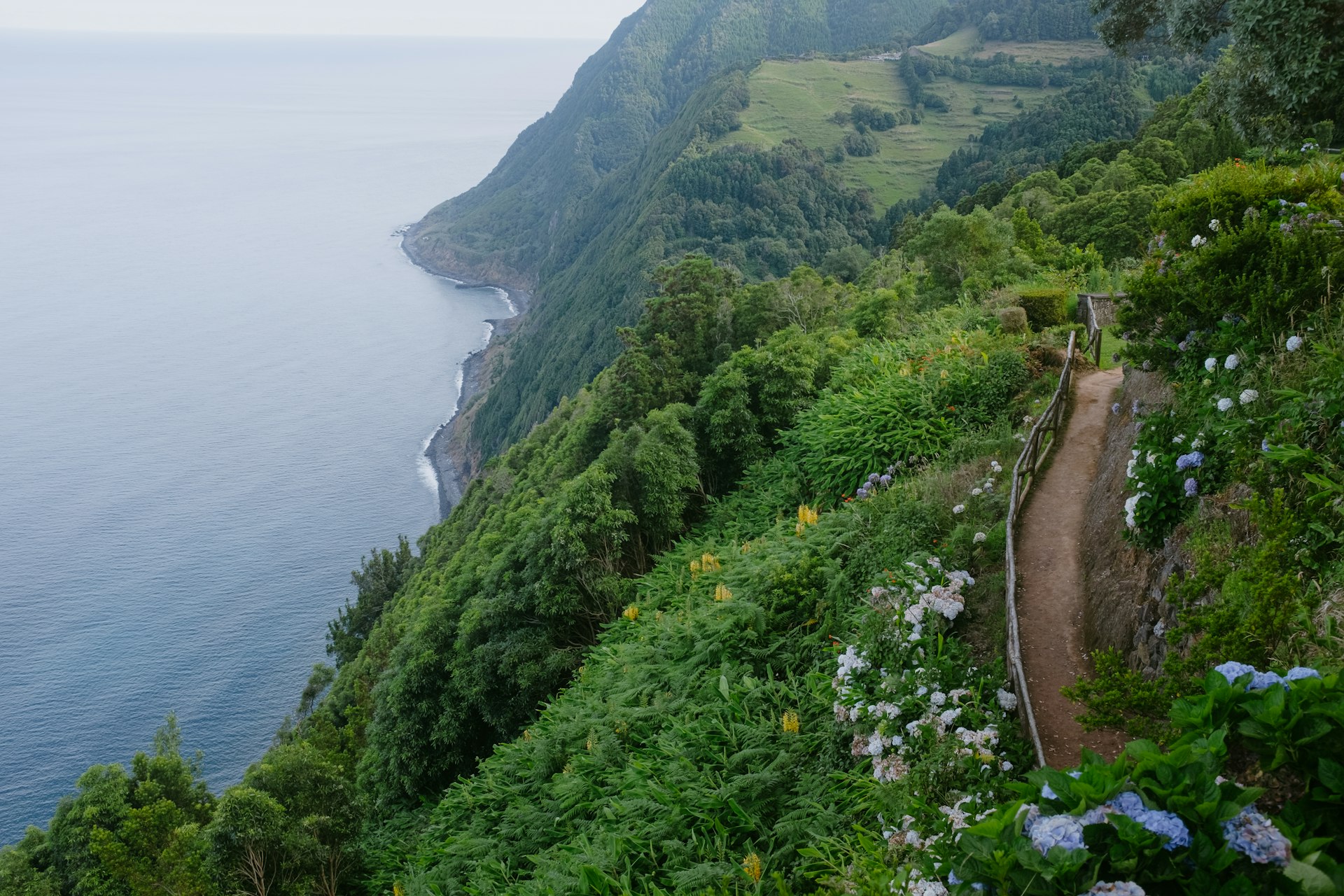 a road next to a body of water