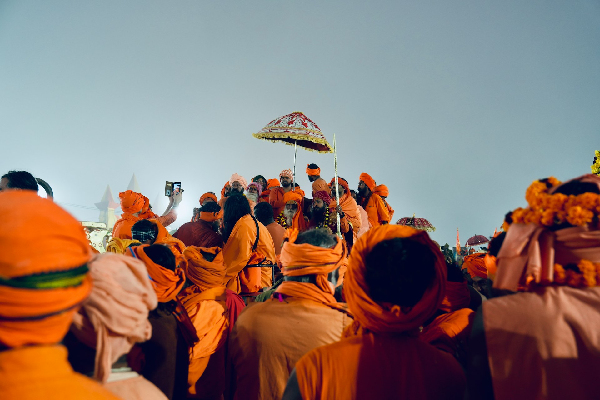 A large group of people dressed in orange