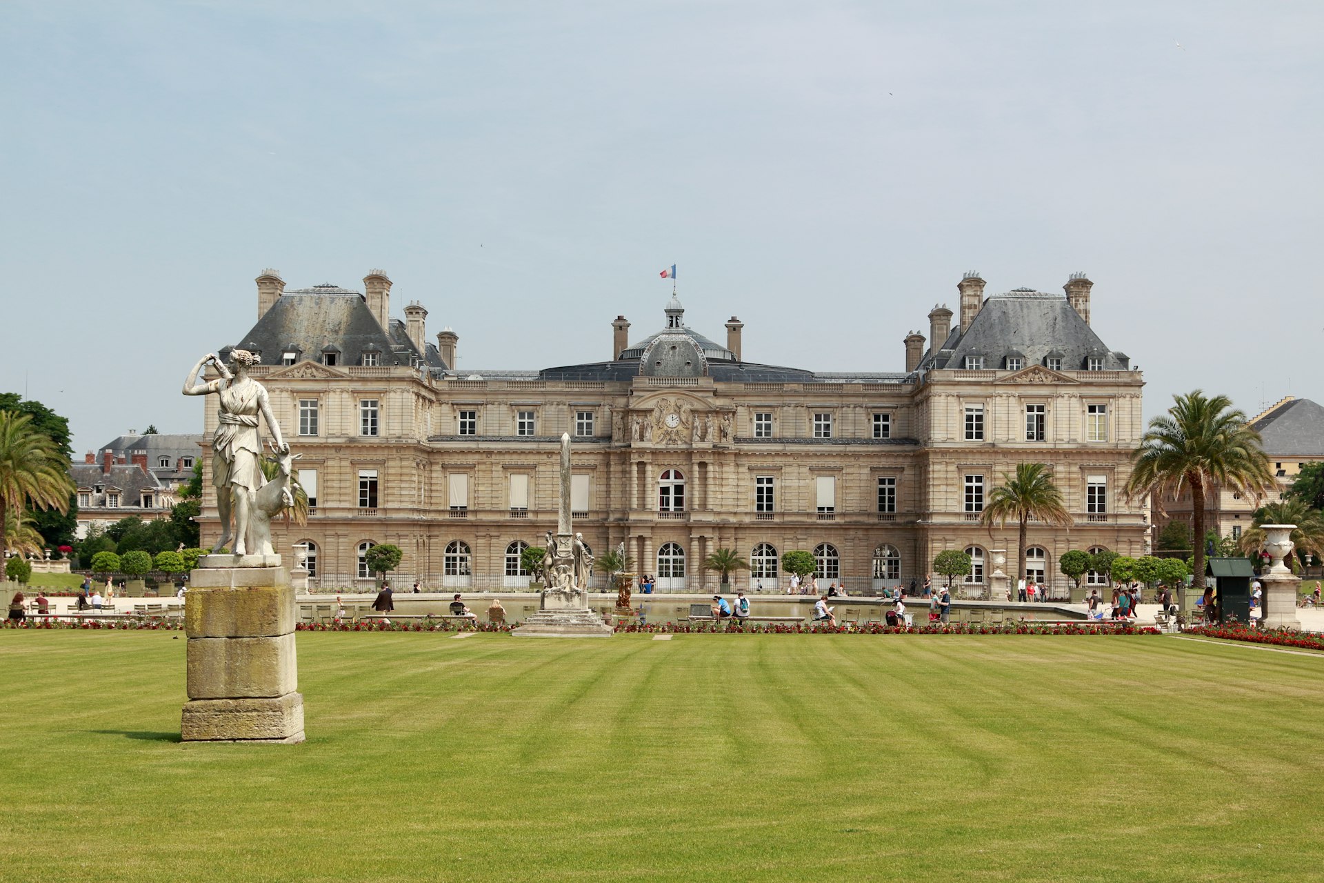 a large building with a statue in front of it
