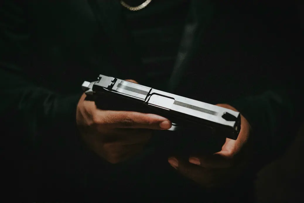 a person holding a gun in their hands