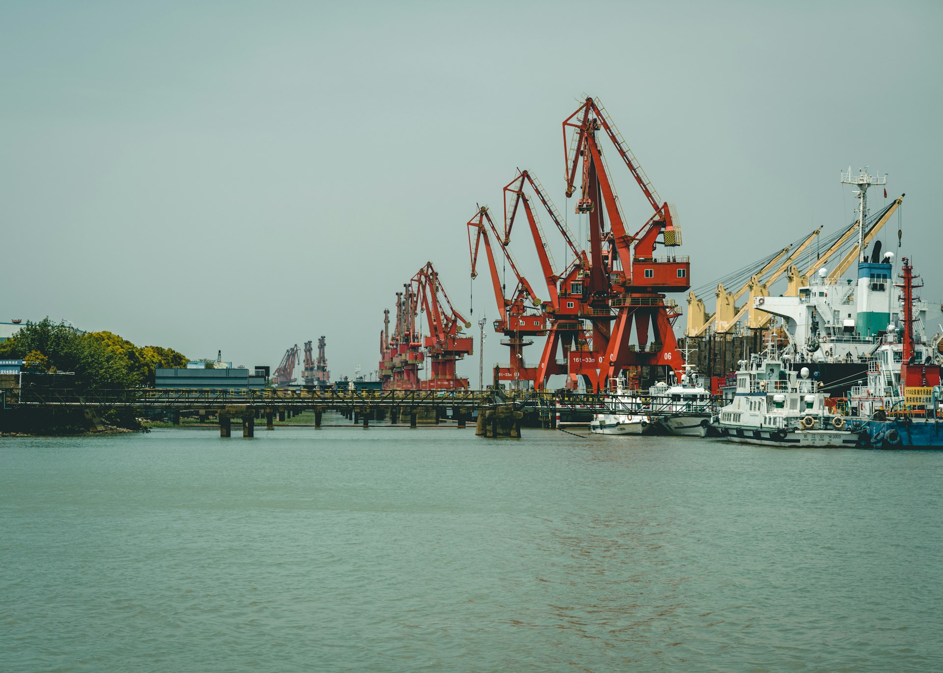 red and white crane on dock during daytime