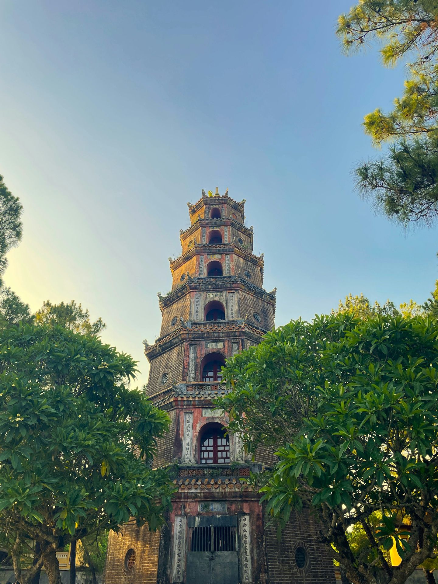 A tall tower with a clock on the top of it